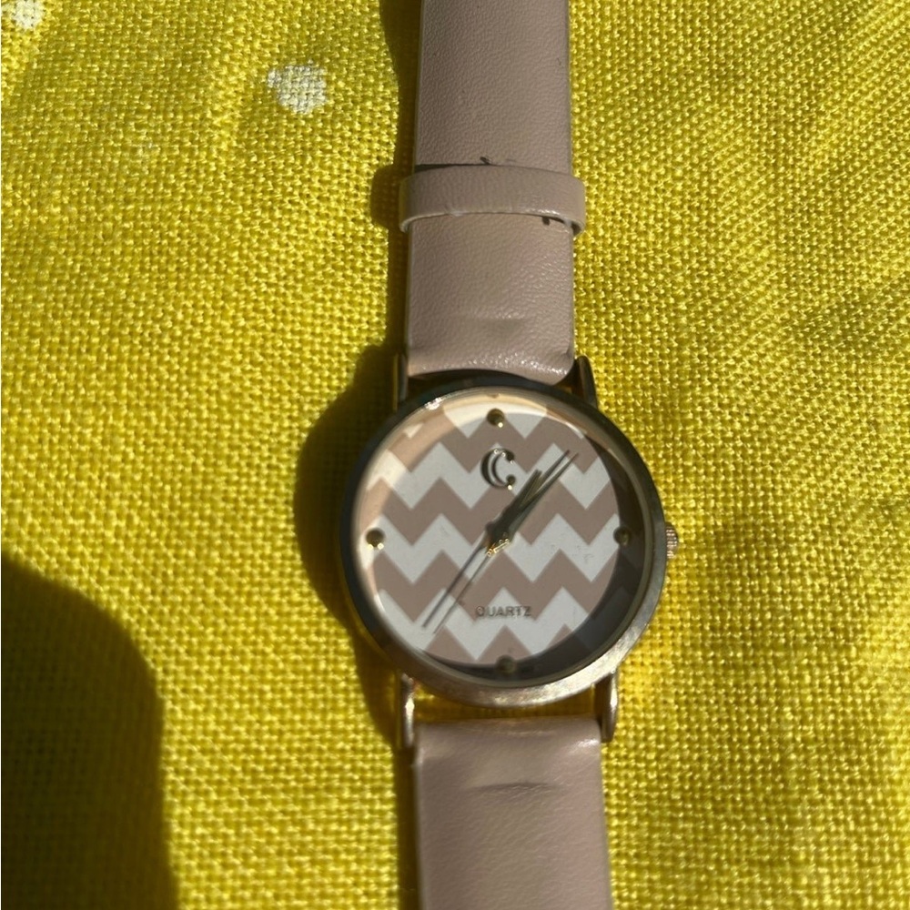 brown and white chevron woman’s watch
